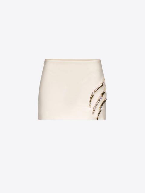 CLAW CUTOUT MINI SKIRT