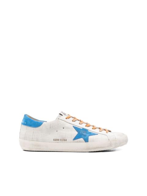 crocodile-effect star low-top sneakers