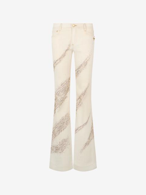 Ivory flared jeans with gold animal-print detailing