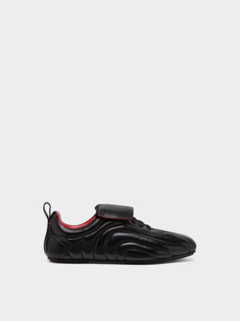 Running trainers in wet-effect leather