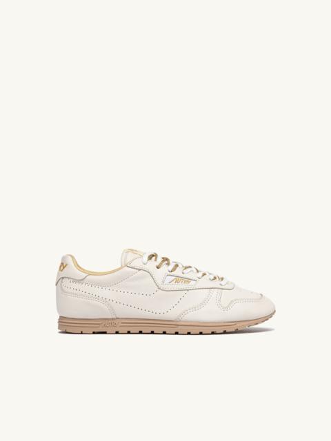 WINDSPIN SNEAKERS IN WHITE AND GOLD NAPA LEATHER