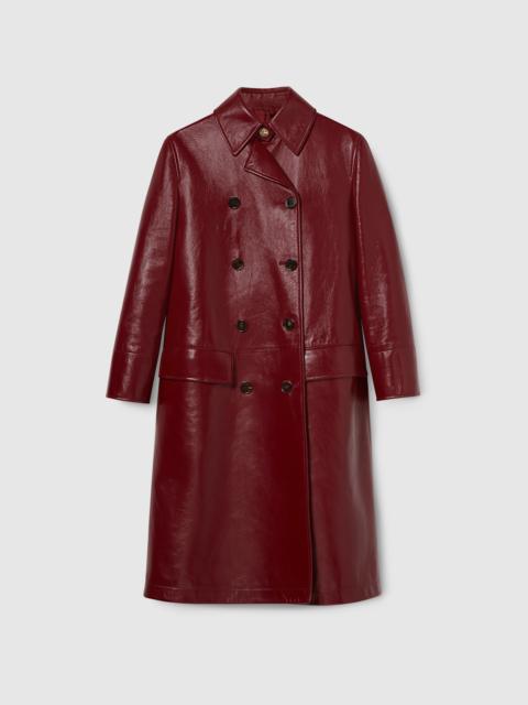 Shiny leather double-breasted coat
