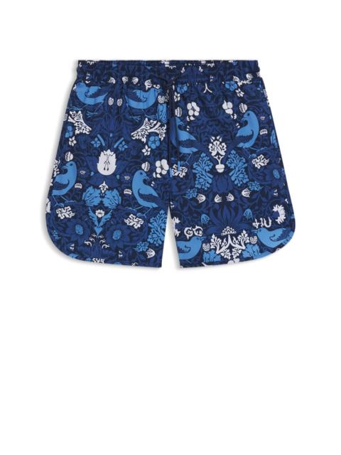 PRINTED SWIM SHORTS WITH EMBROIDERED LOGO