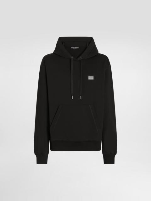 Jersey hoodie with branded tag