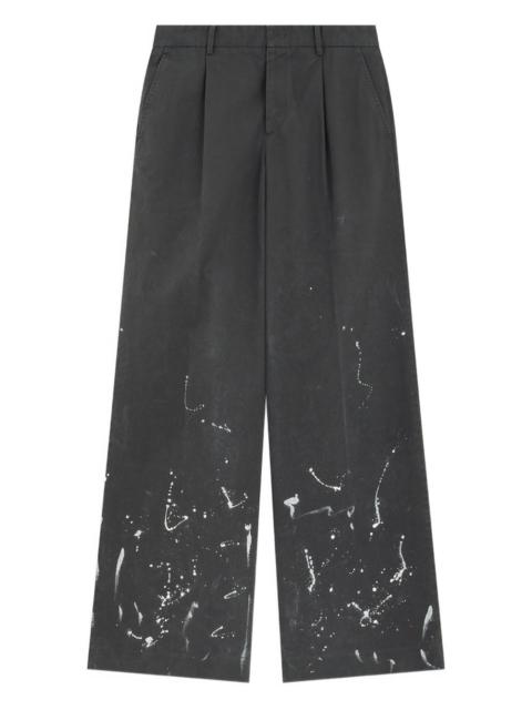 pleated paint-splatter trousers