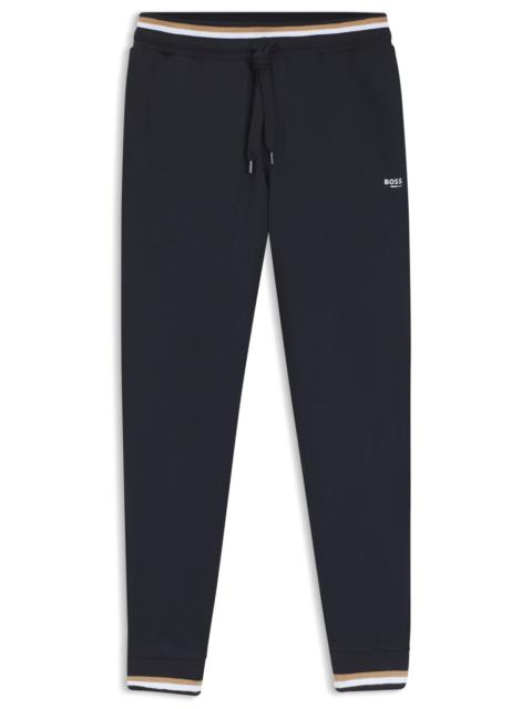 COTTON-TERRY TRACKSUIT BOTTOMS WITH SIGNATURE STRIPES AND LOGO