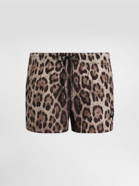 Short swim trunks with leopard print