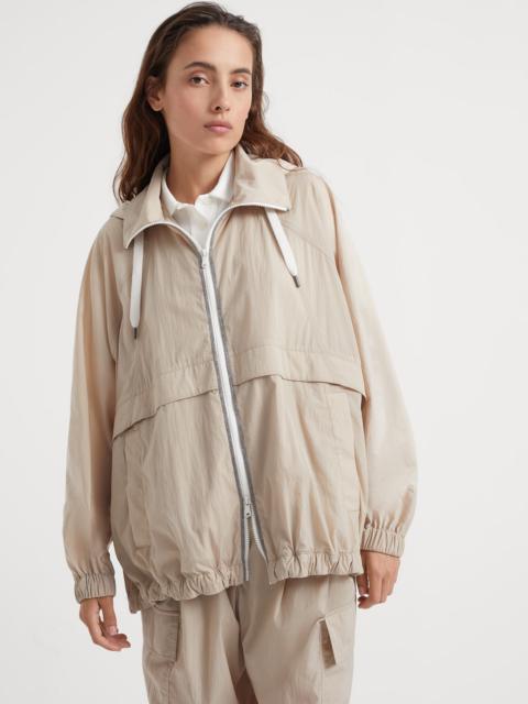 Wrinkled cloth hooded outerwear with precious trims