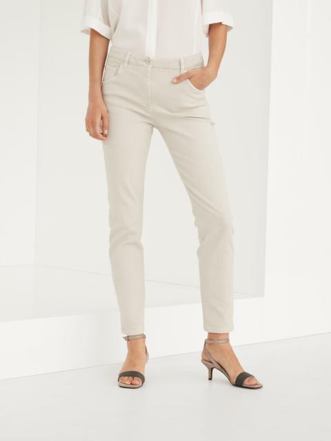 Stretch dyed denim slim trousers with shiny leather tab