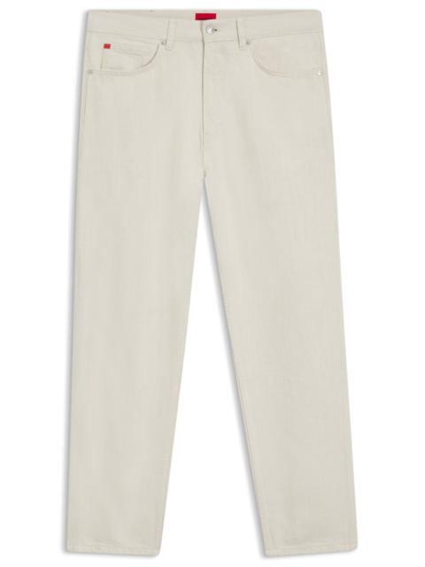 TAPERED-FIT JEANS IN ECRU DENIM