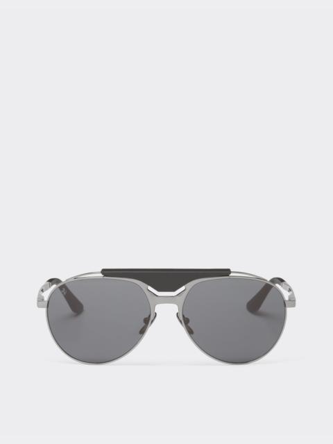 Ferrari sunglasses in gunmetal grey metal and leather with blue lenses