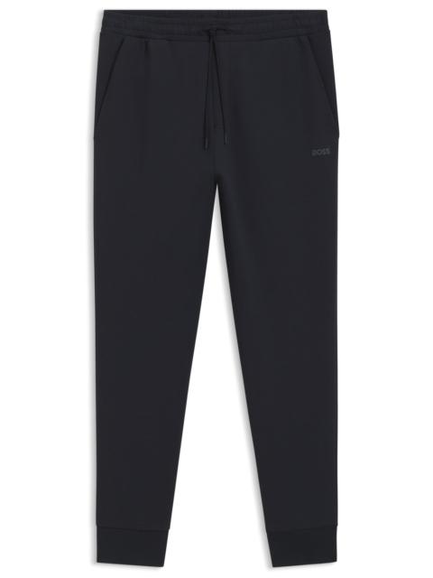 STRETCH-COTTON TRACKSUIT BOTTOMS WITH LOGO PRINT
