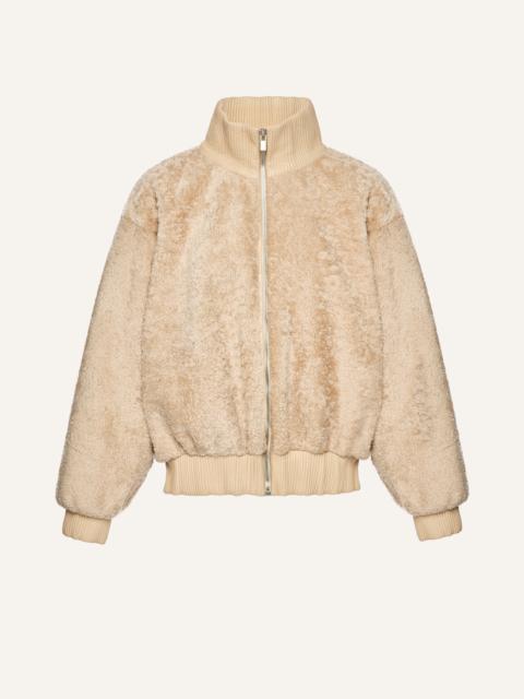 Leather-trimmed shearling bomber jacket in beige