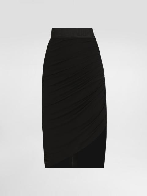 Asymmetrical jersey skirt with draping