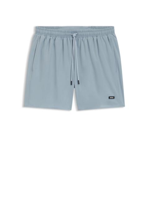 SWIM SHORTS WITH RUBBER LOGO BADGE