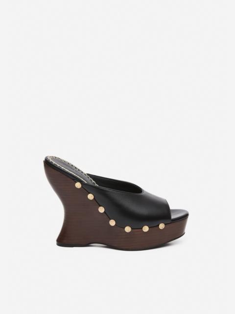 Leather wedge mules in black
