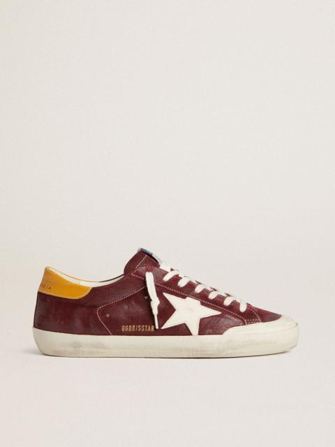 Men’s Super-Star in brick-red suede with white leather star and animal-print heel tab
