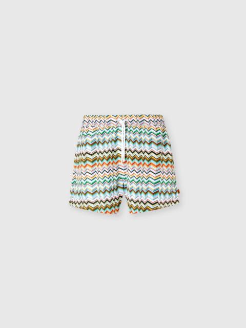 Mid-length swim shorts with irregular zigzag print