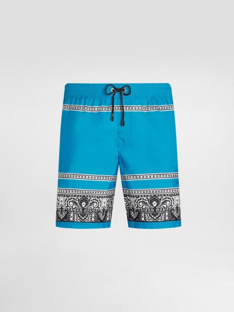 Mid-length swim trunks with bandanna print