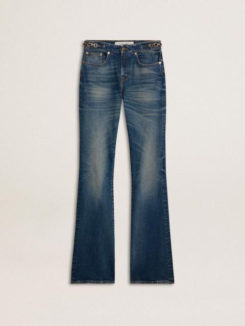 Women's bootcut jeans with a vintage wash and metallic details
