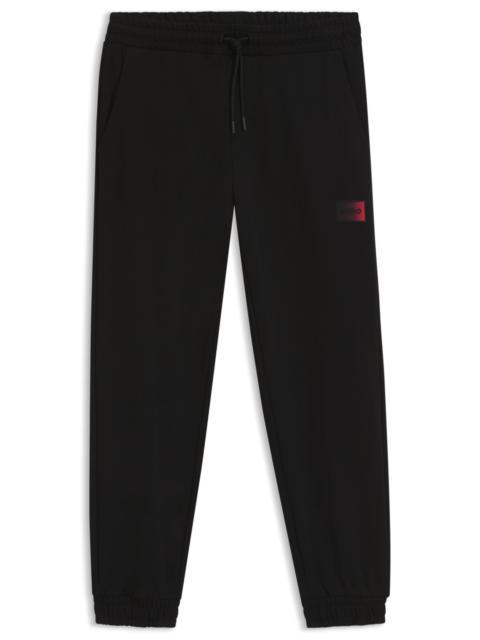 GRADIENT-LOGO TRACKSUIT BOTTOMS IN COTTON TERRY