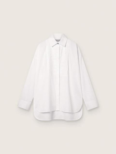 Women's oversized shirt in white cotton with pleated detail and jewel buttons