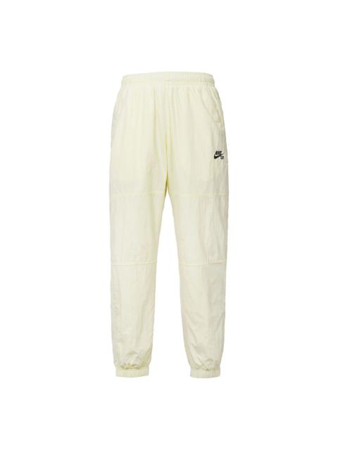 Men's Nike Logo Pattern Loose Bundle Feet Sports Pants/Trousers/Joggers Beige CW7716-113