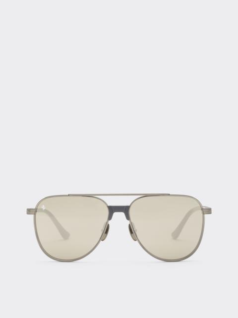 Ferrari sunglasses in  brushed silver titanium and acetate with transparent gold lenses with white m