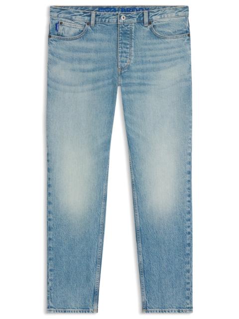 TAPERED-FIT JEANS IN GREEN-CAST STRETCH DENIM