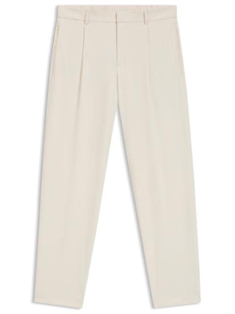RELAXED-FIT TROUSERS IN WATER-REPELLENT STRETCH FABRIC
