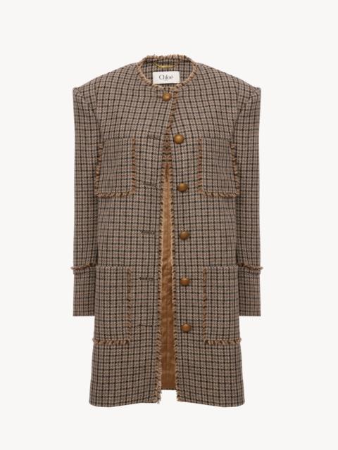 SINGLE-BREASTED COLLARLESS COAT IN HOUNDSTOOTH WOOL