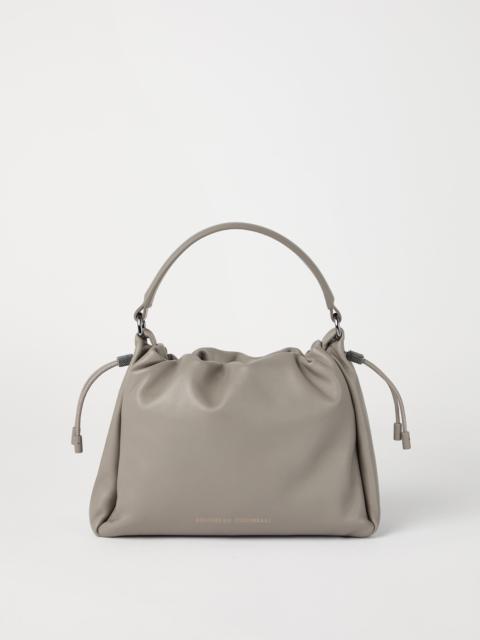 Mellow small bucket bag in soft leather with monili