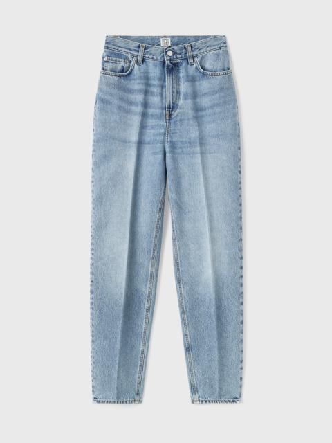 Tapered leg denim worn blue