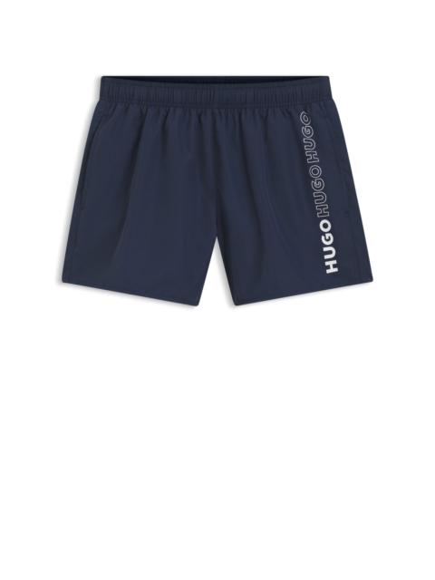 QUICK-DRY SWIM SHORTS WITH VERTICAL PRINTED LOGOS