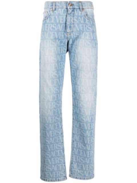 Allover logo-print jeans