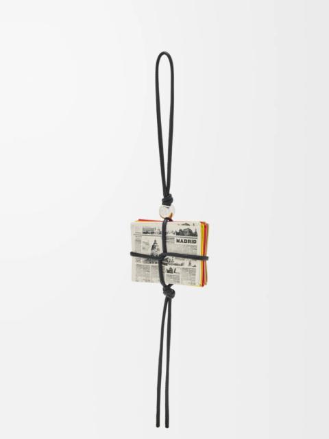 Newspaper charm in calfskin