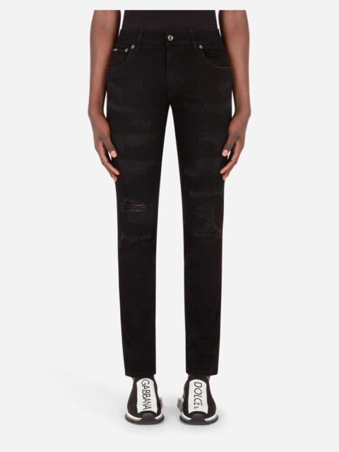 Black skinny stretch jeans with logo print