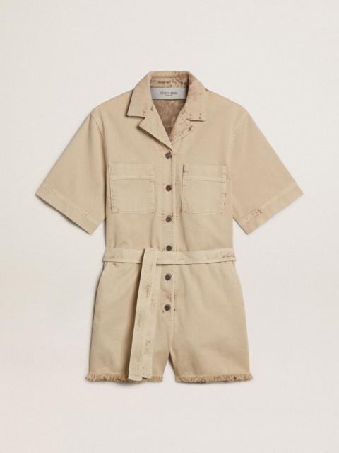 Women's romper in beige denim with belt and frayed hem