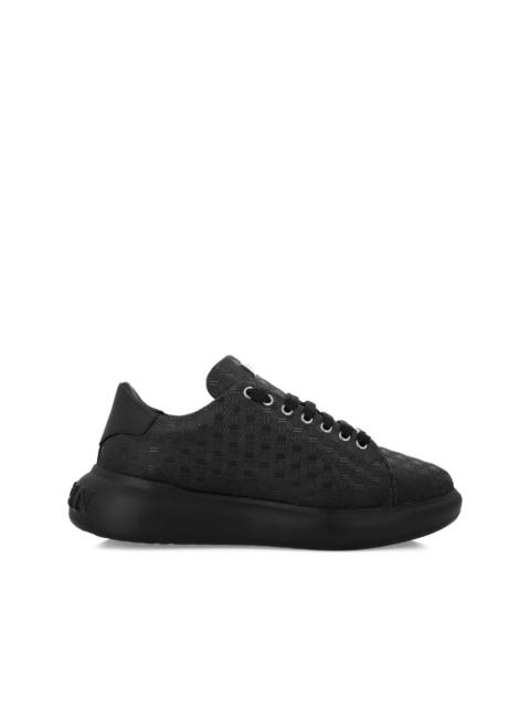 monogram-embossed leather sneakers