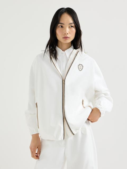 Nylon hooded outerwear jacket with logo and precious trims