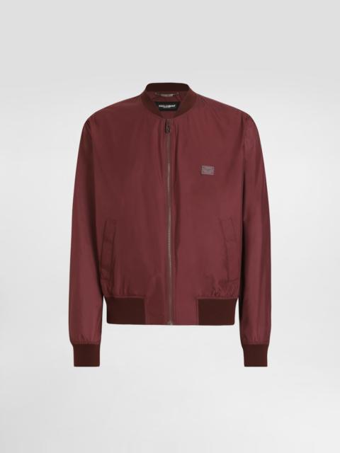 Technical fabric bomber jacket with tag