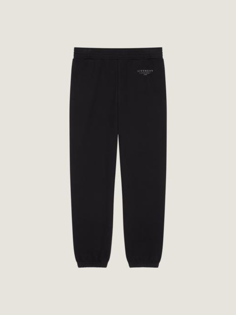 JOGGER PANTS IN FLEECE WITH GIVENCHY STAMP PRINT