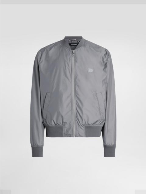 Technical fabric bomber jacket with tag