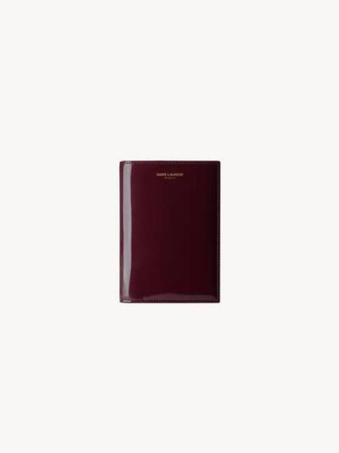 SAINT LAURENT PARIS PASSPORT CASE IN PATENT LEATHER