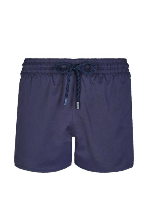drawstring-waist swim trunks