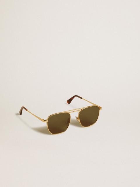 Aviator style sunglasses with gold frame and green lenses