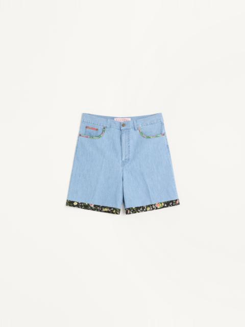 DENIM BERMUDA SHORTS WITH FLORAL PRINT HEM