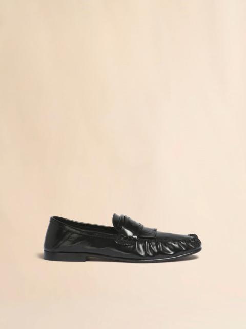 BLACK LEATHER TASSEL LOAFER WITH COLLAPSIBLE HEEL