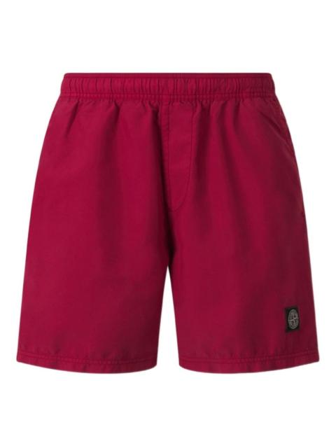 compass-patch swim shorts