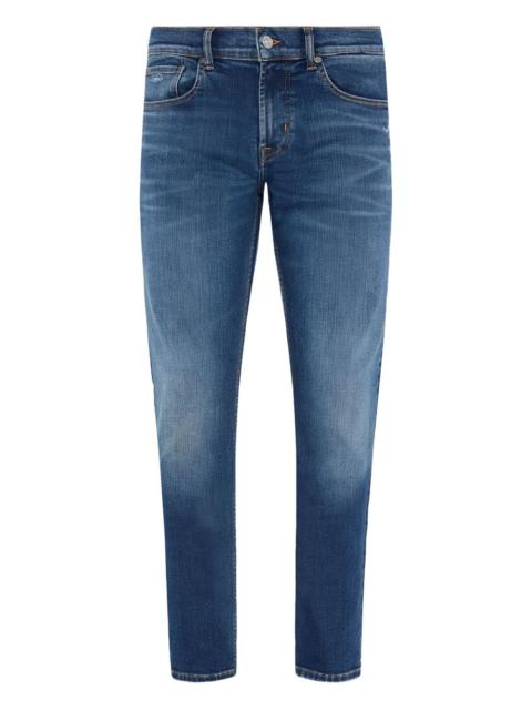 whiskering-effect jeans